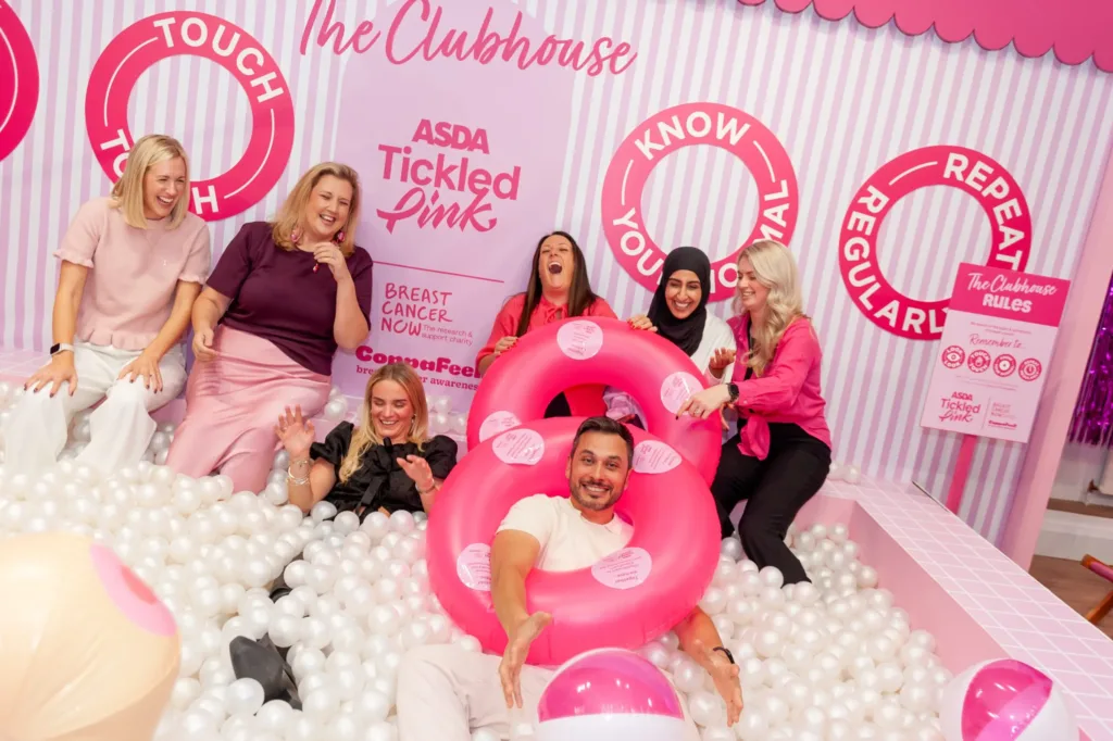 A group of Tickled Pink volunteers in a ball pit.
