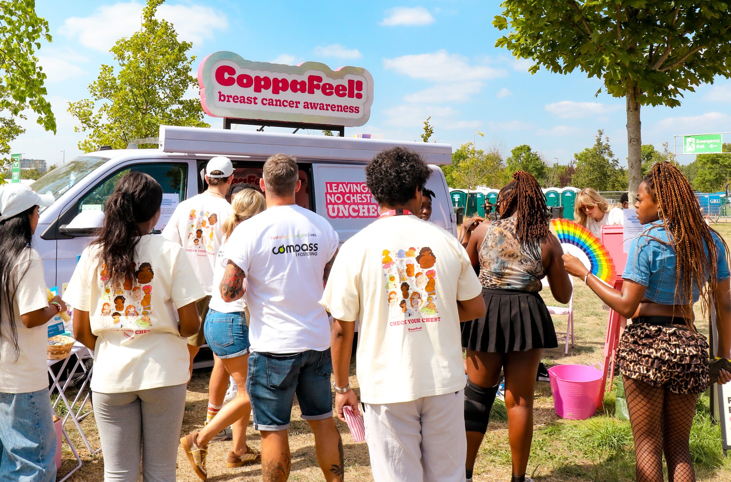Members of the youth network are talking to the public at the CoppaFeel! van.